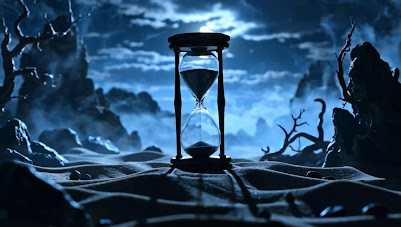 Hourglass with sand caught mid-fall